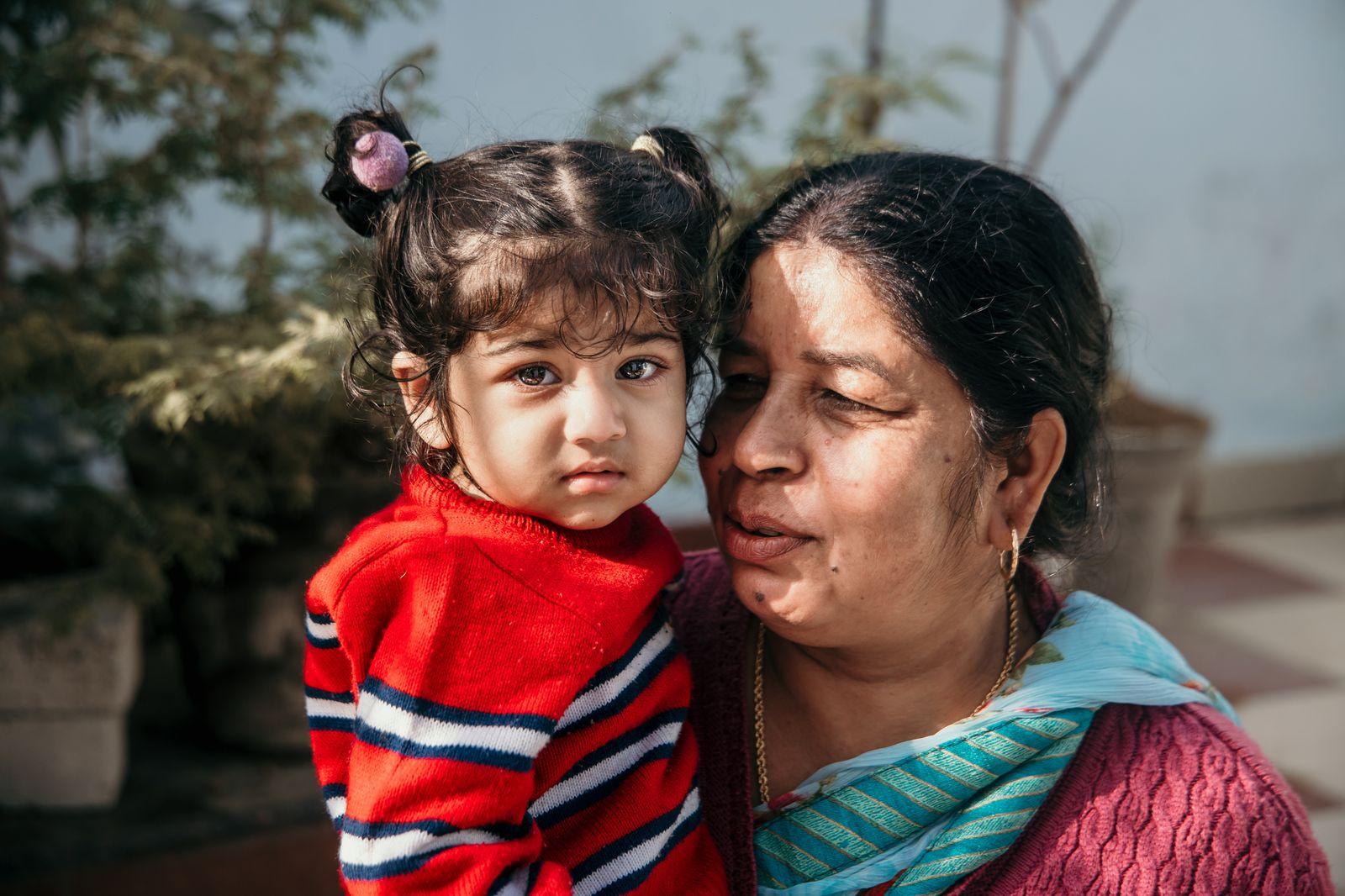 A mother and child together, smiling