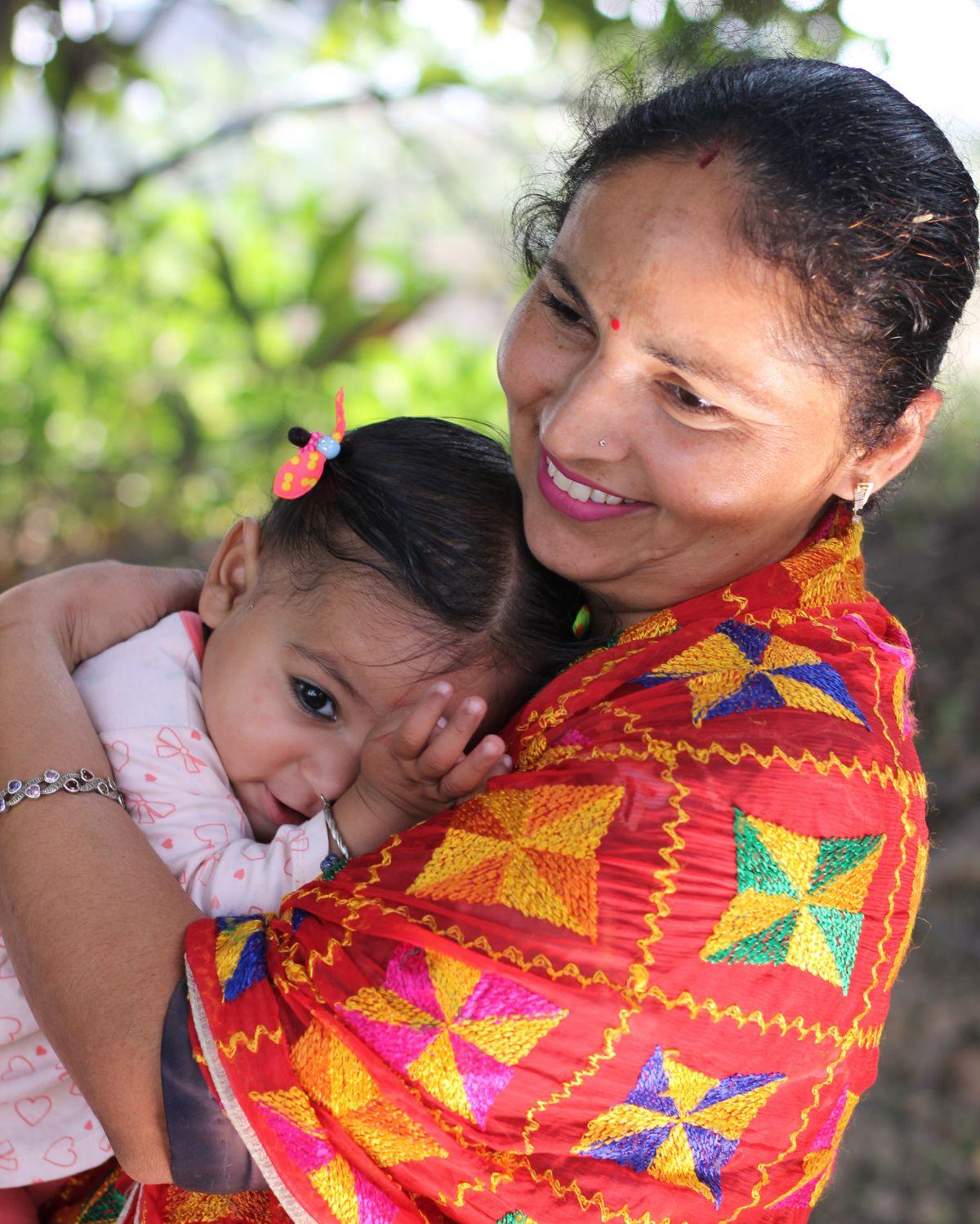 An Indian mother holding her child